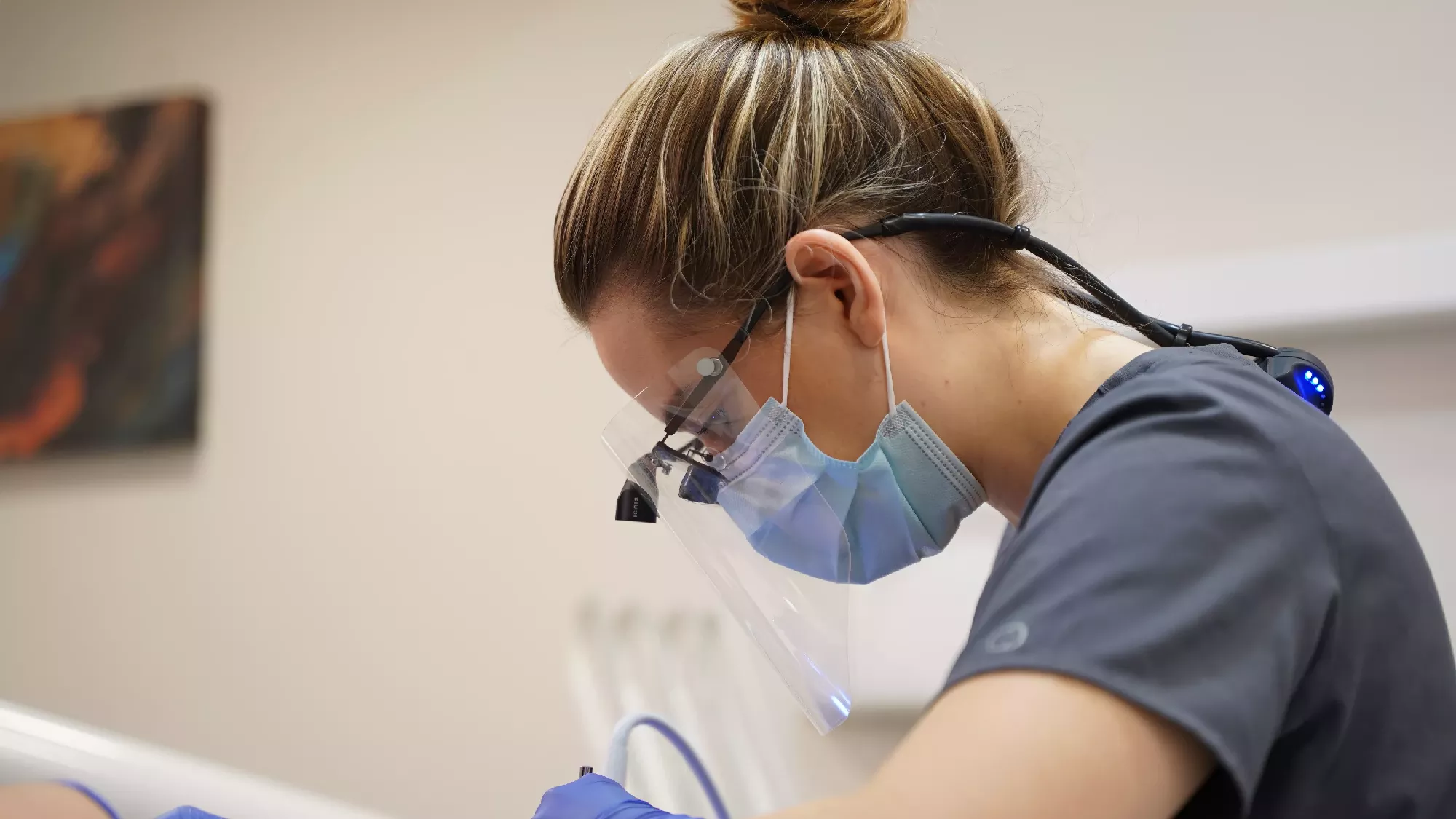 Andrea Ubhi Dentist Treating a Patient.